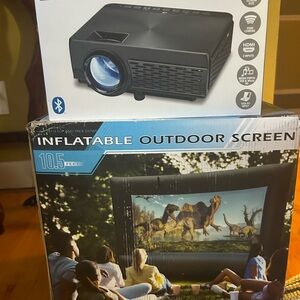 10.5 inflatable outdoor screen and projector. New in the box.